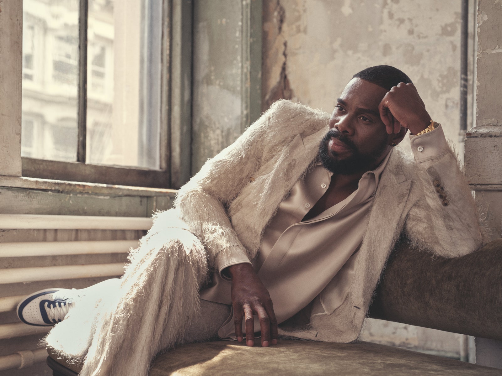 Image may contain Colman Domingo Person Sitting Face Head Photography Portrait Adult Sad Clothing and Footwear